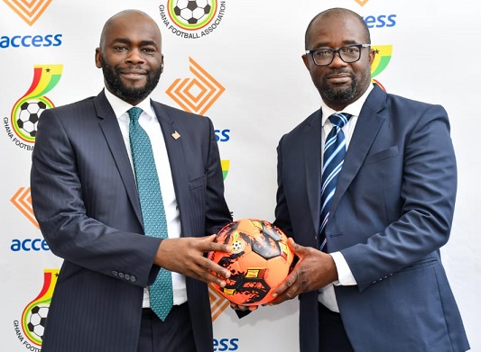 Mr Olumide Olatunji(left), Managing Director of Access Bank Ghana PLC,joins hands with Kurt Okraku, GFA president, to develop football.